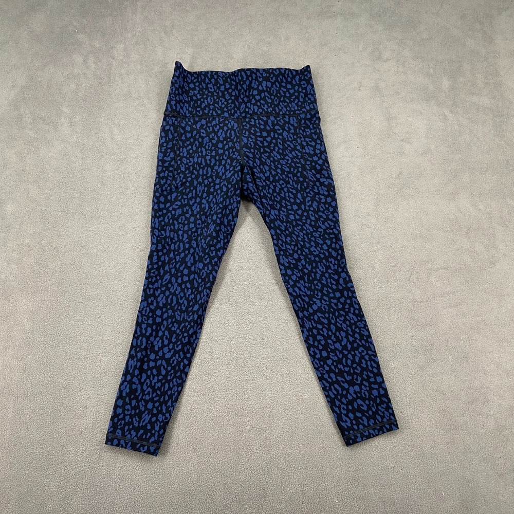 Athleta Salutation Stash Pocket II 7/8 Leggings Womens Small Blue Leopard Print
